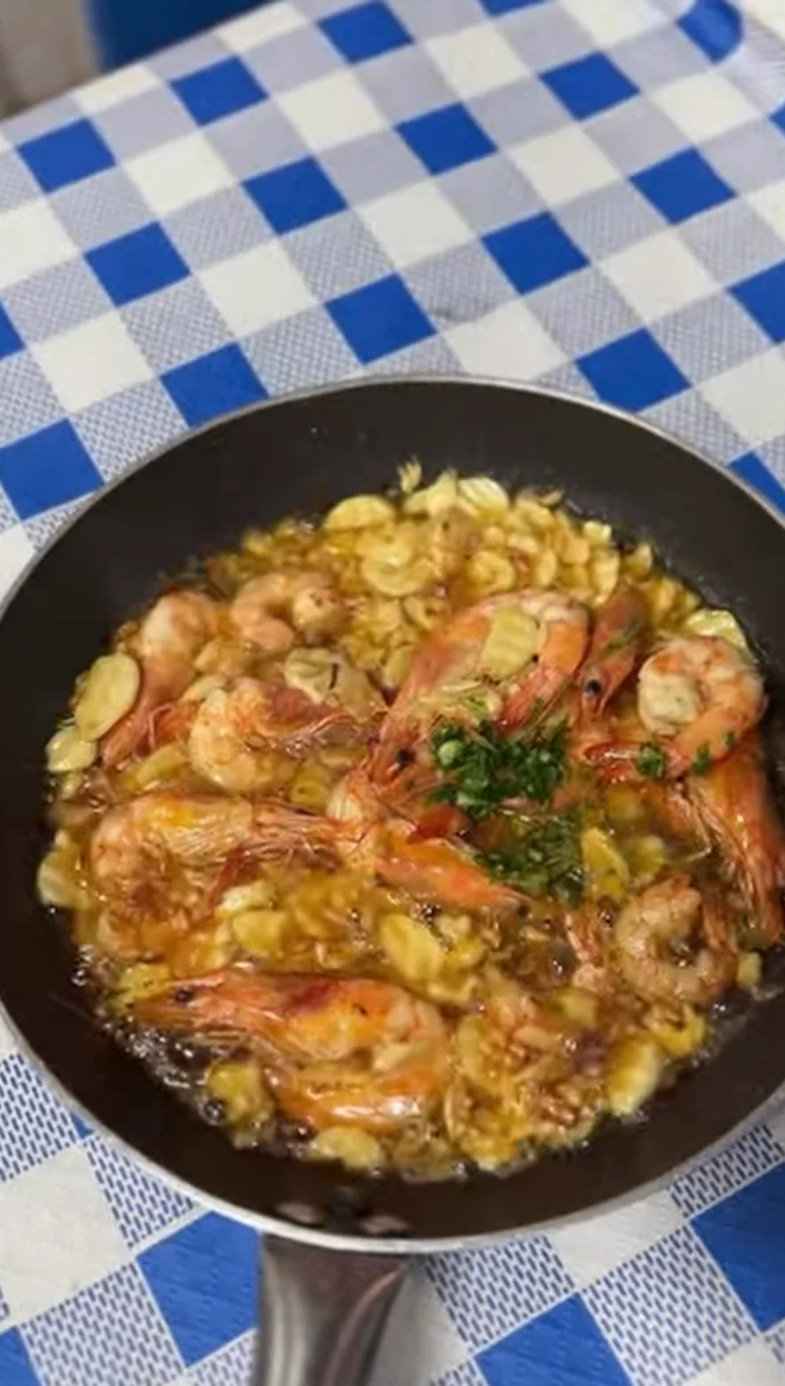 Pan of sizzling garlic prawns